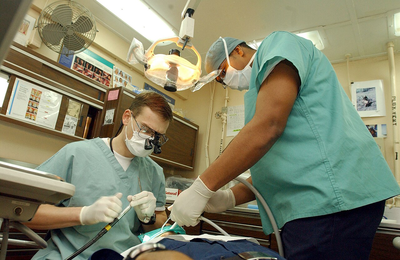 Modern European dental clinic operatory with chair and equipment